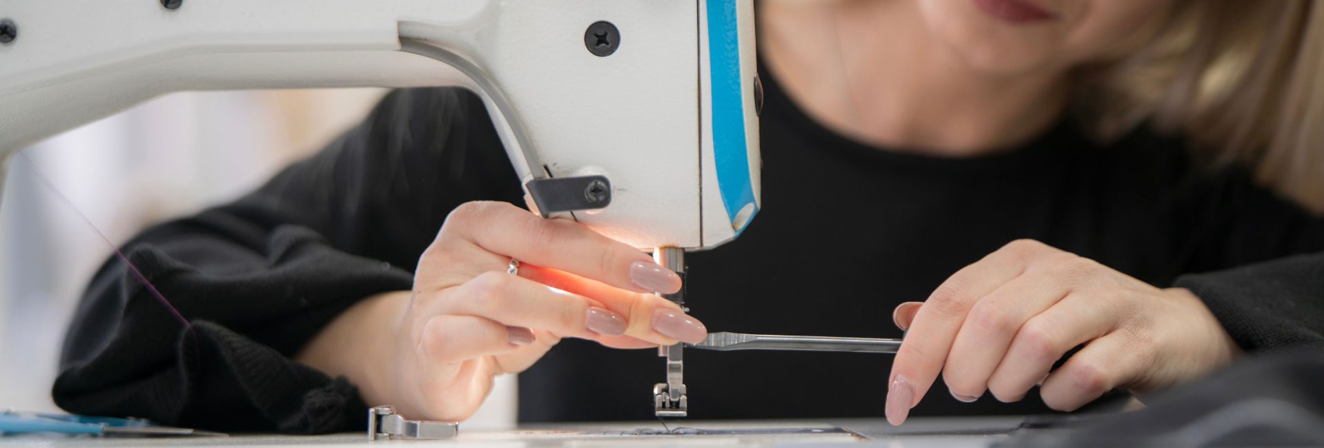 Woman At Sewing Machine 1920X650